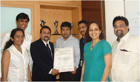 Mr. Neil Fernandez Country Risk Head India and South Asia- VISA presenting the Avenues Management Team the PCI-DSS version 2.0 Certificate